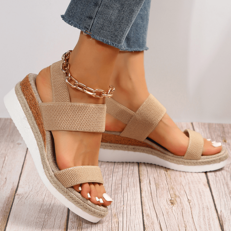 Lightweight orthopedic platform sandals featuring elastic straps and a sporty sole, designed for comfort and support, made from vegan materials. 0